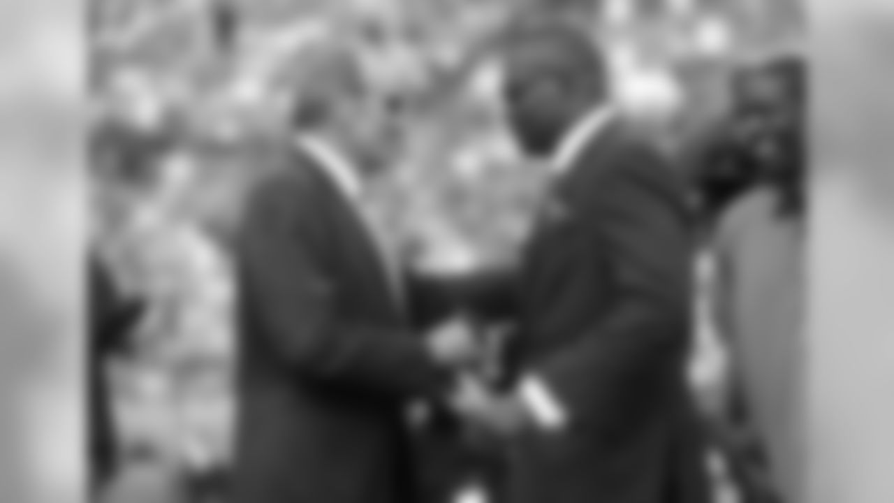Denver Broncos owner Pat Bowlen shakes former Denver Broncos Rod Smith's hand during the Ring of Fame ceremony at halftime against the Houston Texans at Sports Authority Field in Denver Colorado on September 23, 2012.
(Photo credit: Gabriel Christus/Denver Broncos)