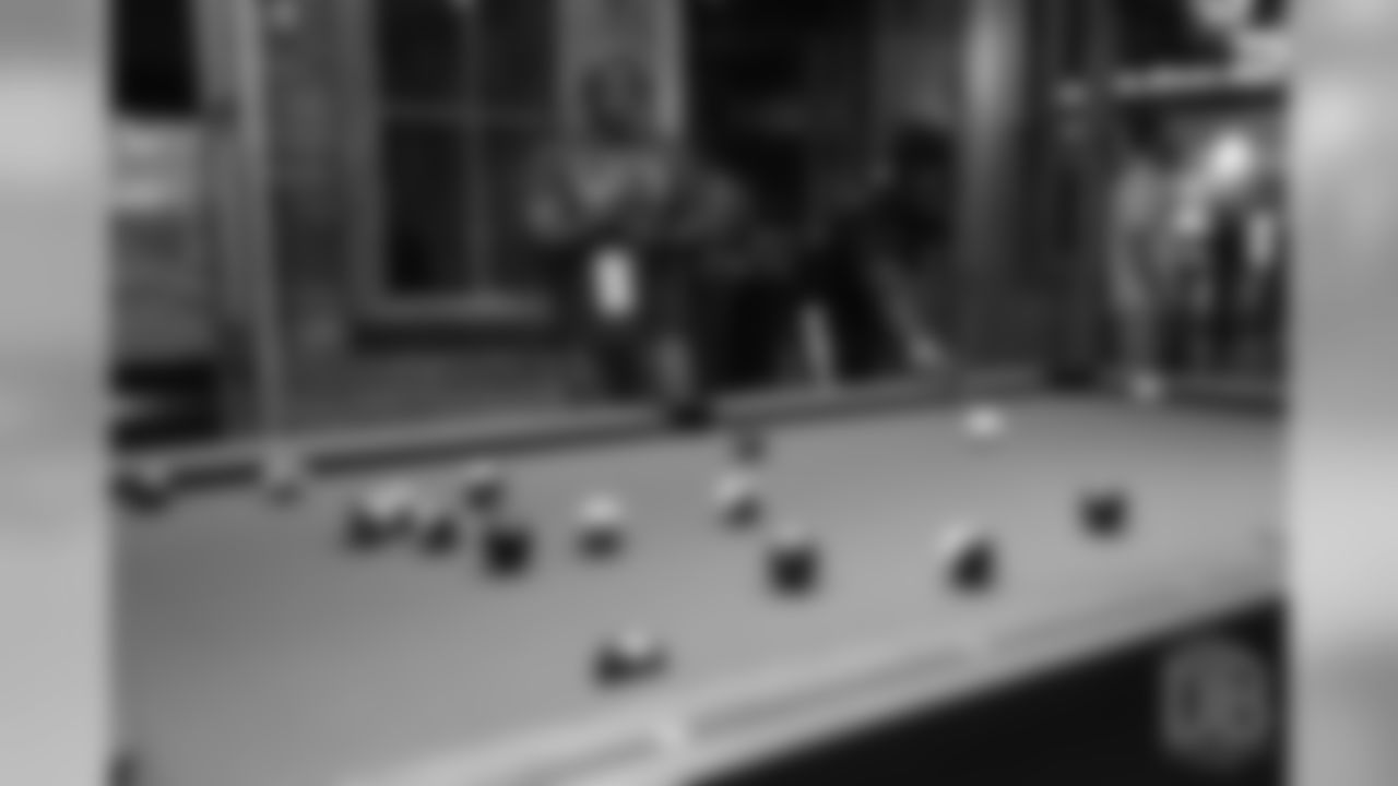 Von Miller's father and Shaquil Barrett play pool the first day of Von Miller's Pass Rush Summit, which included a welcome session and a night of games on June 27, 2018.