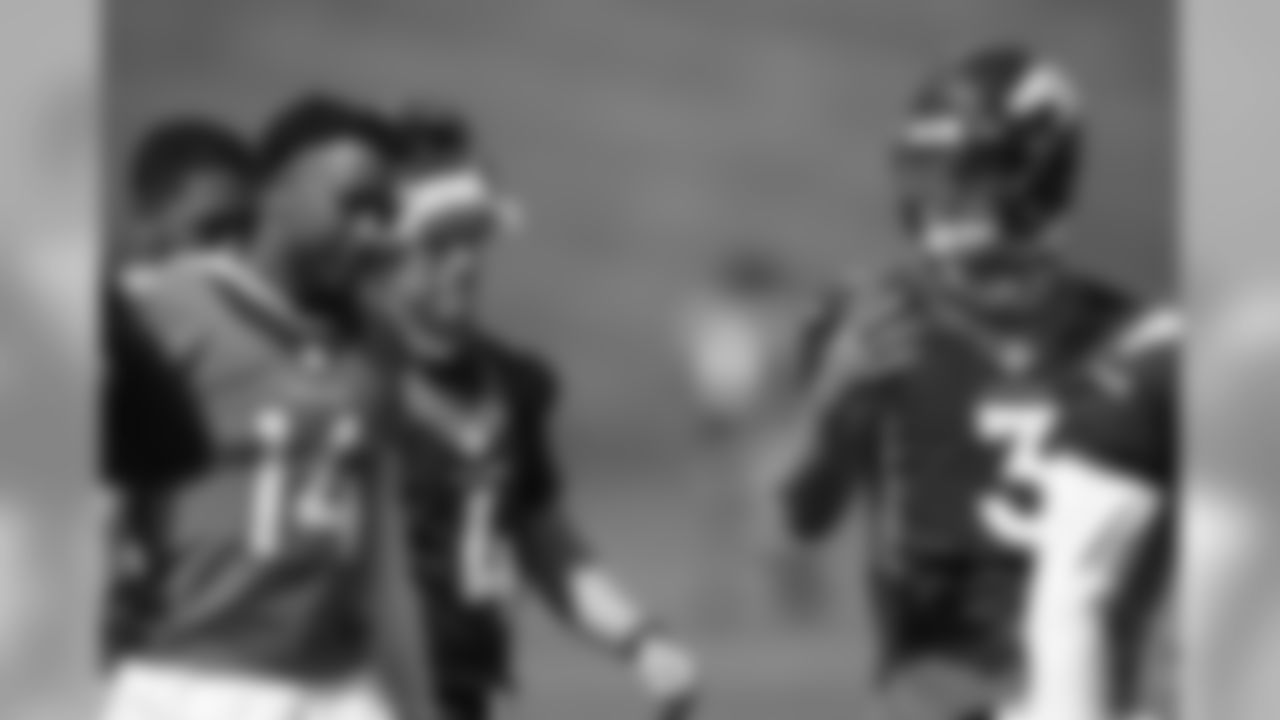 Courtland Sutton talks with Drew Lock after the first training camp practice at UCHealth Training Center on August 14, 2020. (Photo by Ben Swanson)
