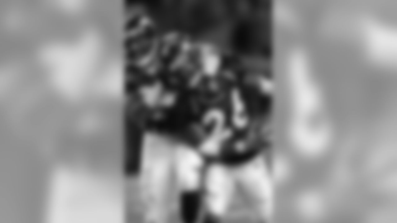Rod Smith celebrates with Clinton Portis after Portis rushed for his fifth touchdown on the day against the Kansas City Chiefs at Invesco Field at Mile High in Denver, CO on December 7, 2003.