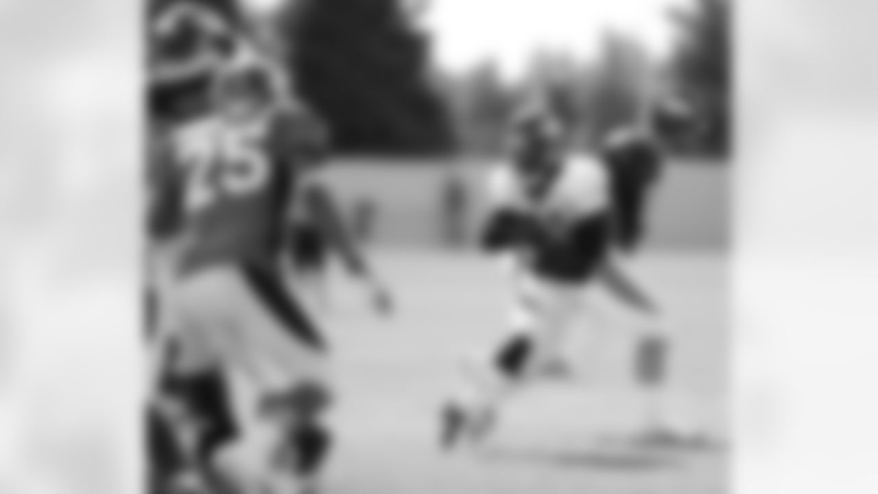 Hillman takes the handoff from Manning.
