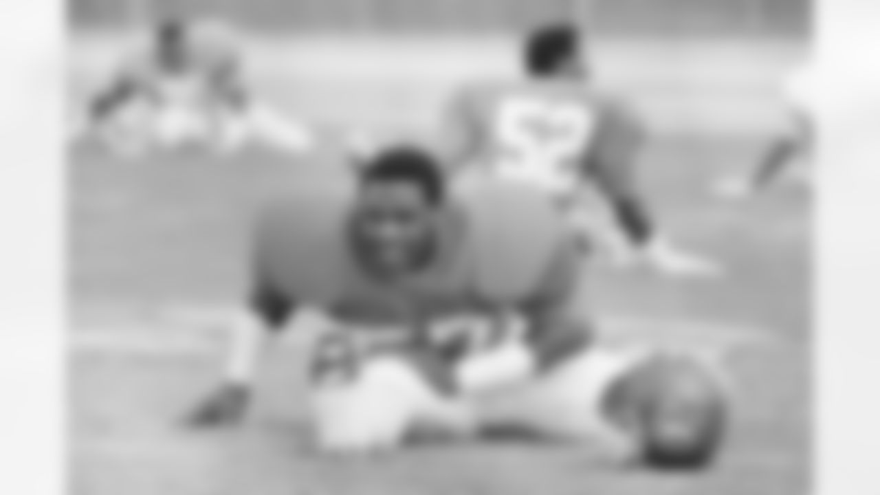 Denver Broncos linebacker Tom Jackson (57) smiles while stretching in preparation for a workout, Jan 22, 1987, Irvine, Calif. (AP Photo/Ed Andrieski)