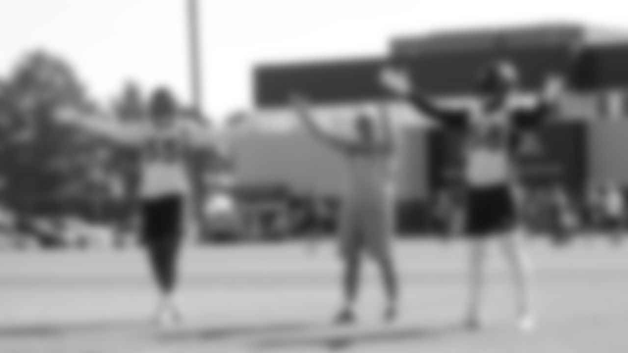 Bradley Chubb, Head Coach Vic Fangio and Von Miller start a slow clap with the fans in the crowd before practice on Day 17 of training camp on August 13, 2019.