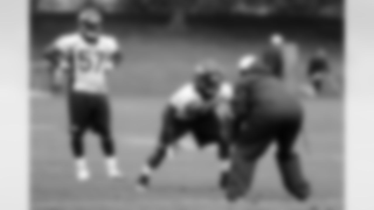 LB Danny Trevathan works on a drill against assistant special teams coach Keith Burns.