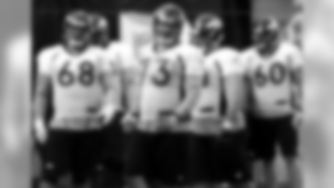 The offensive line gets ready to start a drill.