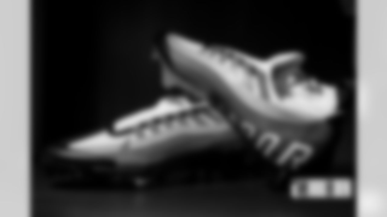 Javonte Williams' cleats in the locker room before the Broncos' Week 2 game against the Houston Texans at Empower Field at Mile High in Denver, Colorado on September 18, 2022. (Photo by Ben Swanson)