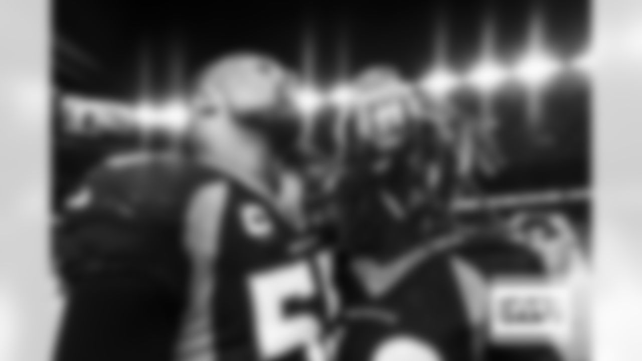 Bradley Chubb and Nik Bonitto on the sideline during the Broncos' Week 3 game against the San Francisco 49ers at Empower Field at Mile High in Denver, Colorado on September 25, 2022. (Photo by Ben Swanson)
