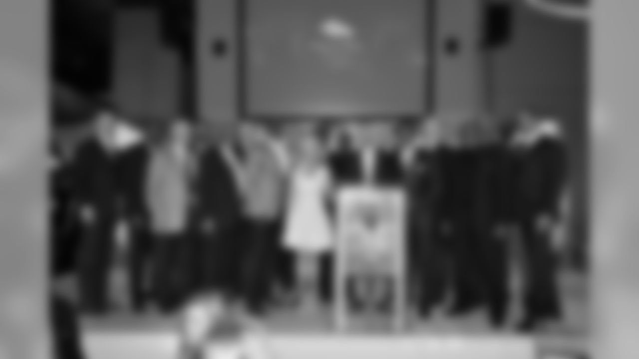 Annabel Bowlen and members of the Ring of Fame gather after the induction dinner.