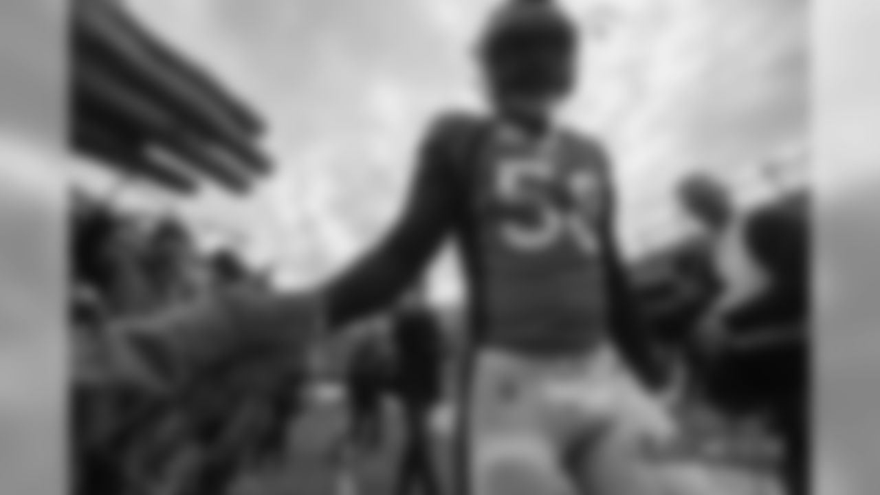 Von Miller high-fives fans before the Broncos' Week 17 game against the Los Angeles Chargers at Broncos Stadium at Mile High on December 30, 2018.