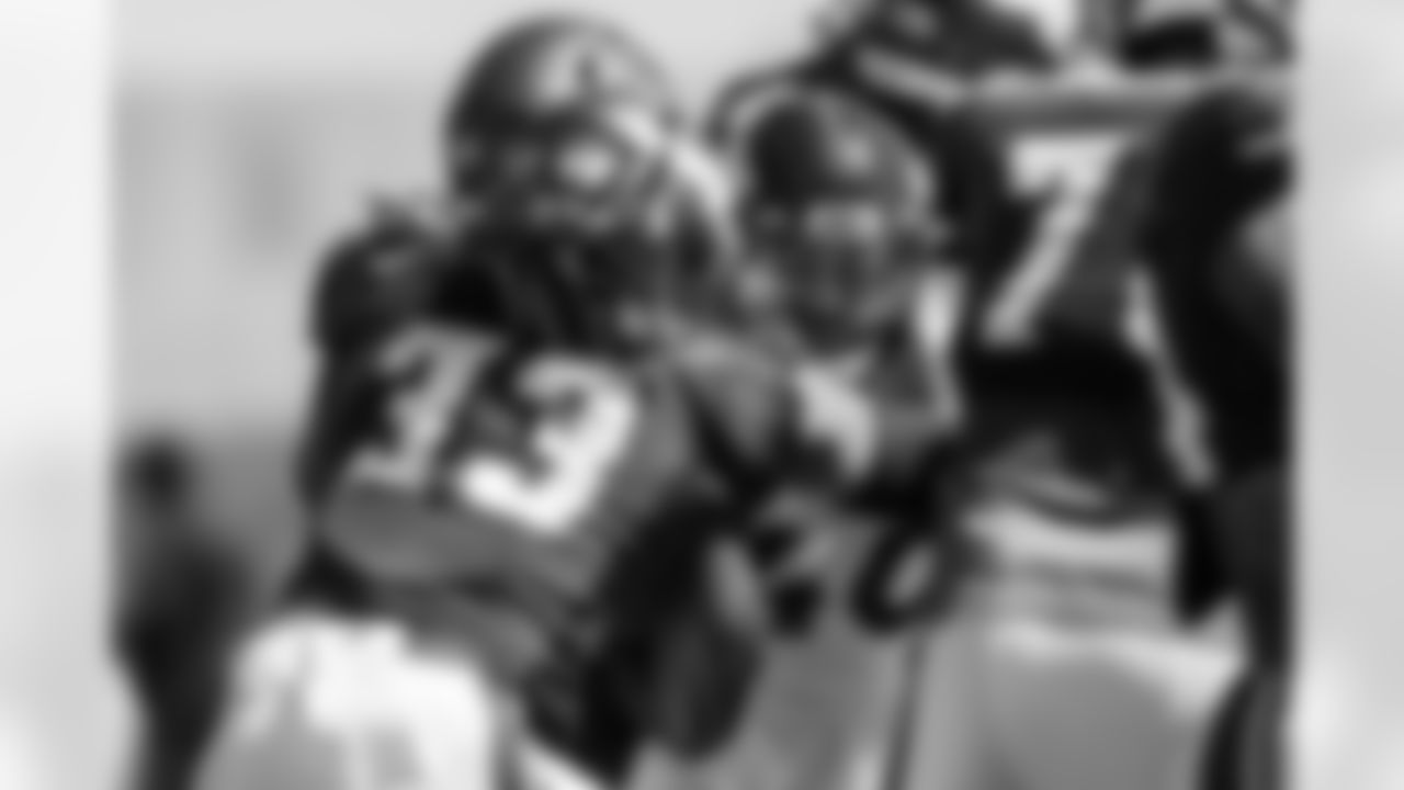 Justin Strnad looks to get to Minnesota Vikings running back Dalvin Cook (33) during a joint practice with the Minnesota Vikings amid training camp at TCO Performance Center on August 12, 2021. (Photo by Ben Swanson)