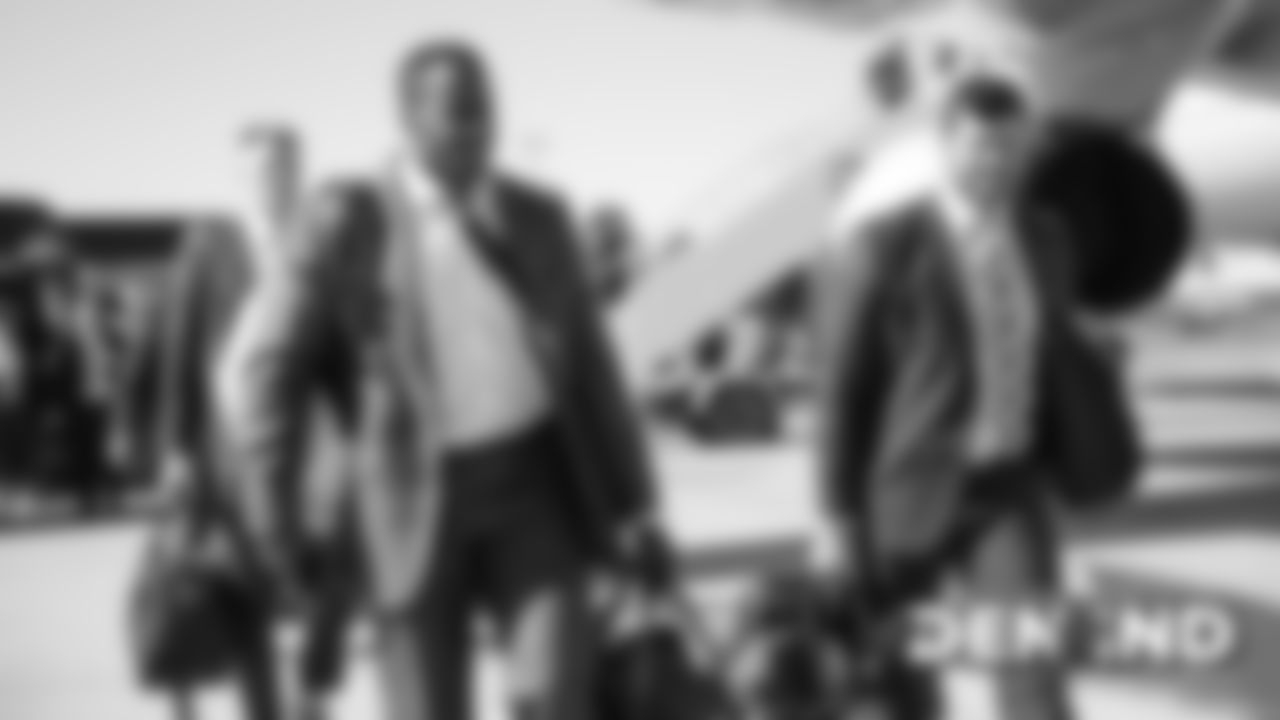 Joe Jones and Josey Jewell on the tarmac at Denver International Airport during the team's travel to Indiana on October 26, 2019 ahead of their Week 8 game against the Indianapolis Colts. (Photo by Ben Swanson)
