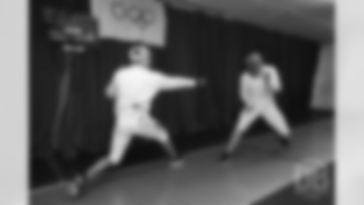Brandon McManus and Casey Kreiter try their hands at fencing at the Denver Fencing Center on July 17, 2018.