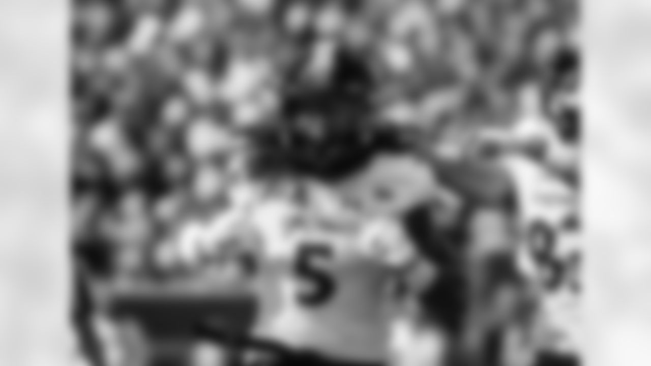 Cincinnati running back Mike Boone (5) celebrates scoring a touchdown in the first quarter of an NCAA college football game against Michigan in Ann Arbor, Mich., Saturday, Sept. 9, 2017. (AP Photo/Tony Ding)