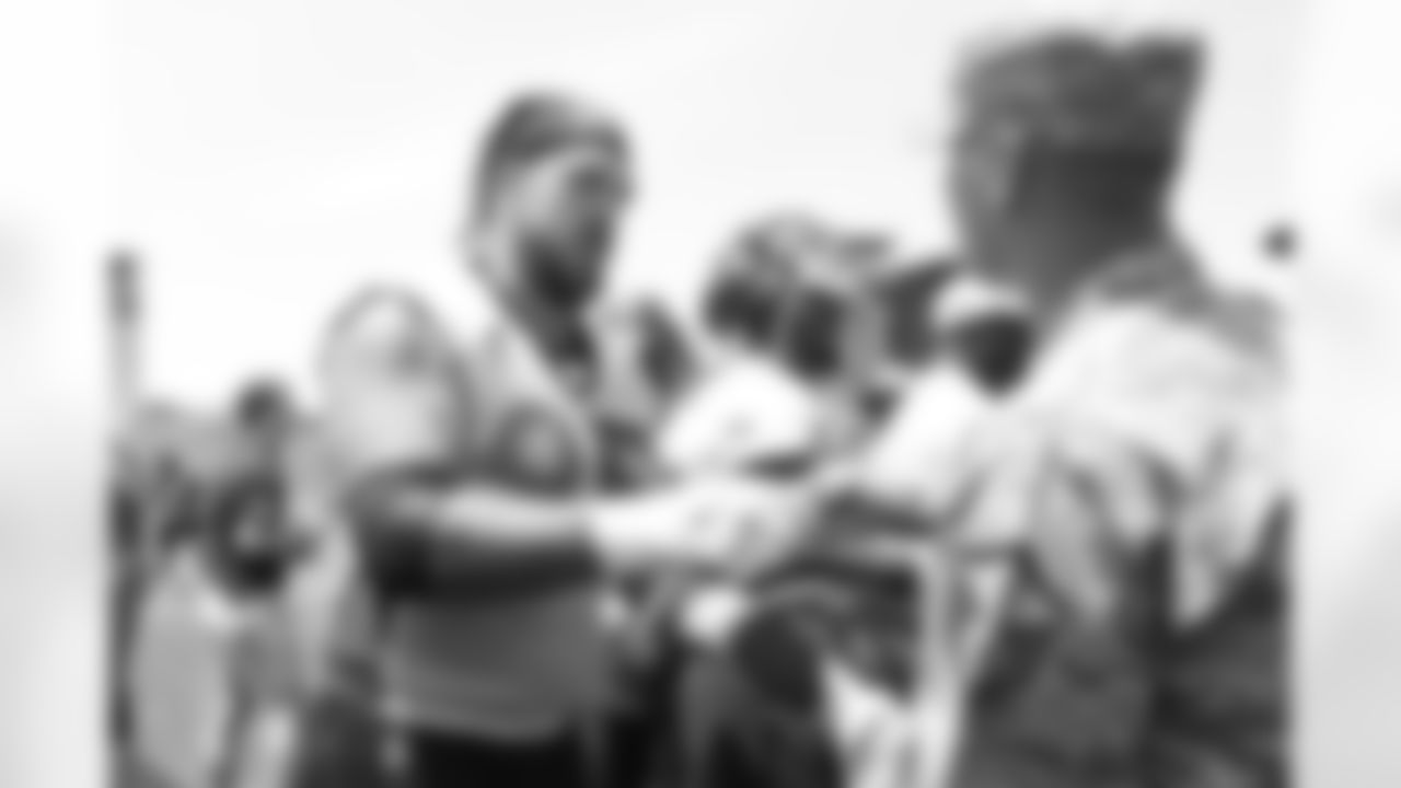 Defensive end Derek Wolfe (95) meets military members of the Colorado Air National Guard and the U.S. Army after practice on June 12, 2018. The meet-and-greet was part of an event hosting servicemen and servicewomen with USAA and the Broncos Womens Organization.