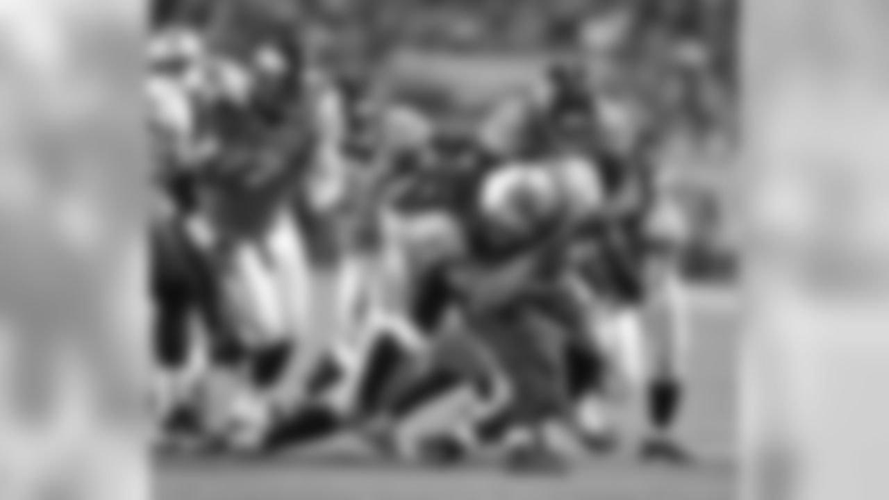 Miller and DT Kevin Vickerson combine for a first-half tackle.