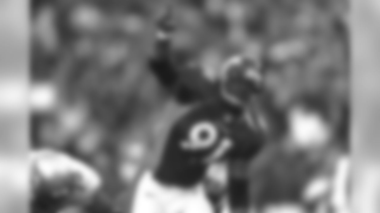 Alfred Williams celebrates after a defensive play against the Seattle Seahawks at Mile High Stadium in Denver, CO on December 27, 1998.