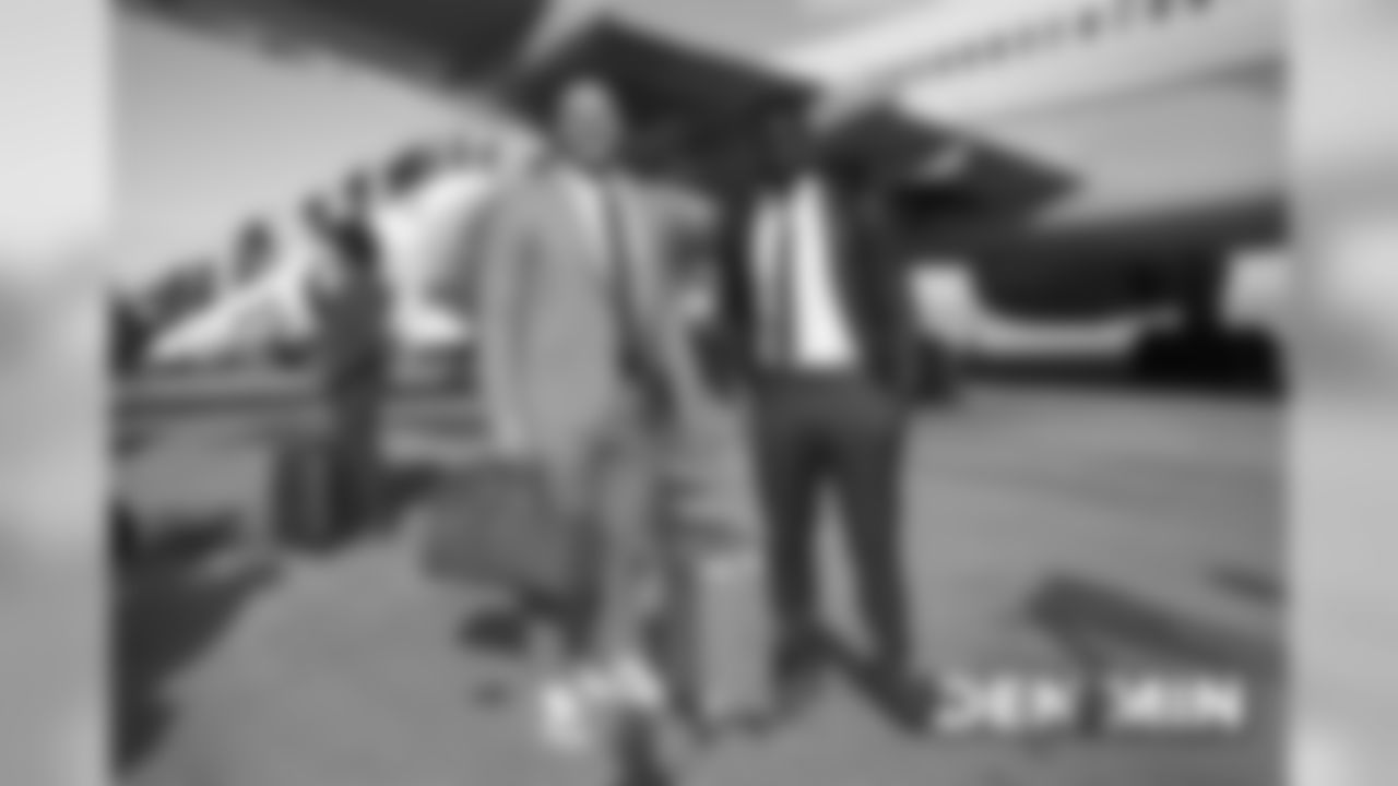 Adam Gotsis and Jeremiah Attaochu on the tarmac at Denver International Airport during the team's travel to Minnesota on November 16, 2019 to face the Vikings.. (Photo by Gabriel Christus)