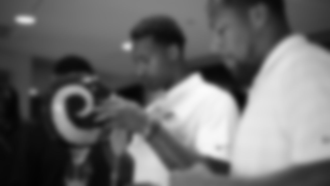 Courtland Sutton looks at an early NFL helmet during a tour of the Pro Football Hall of Fame in Canton, Ohio, on July 31, 2019.