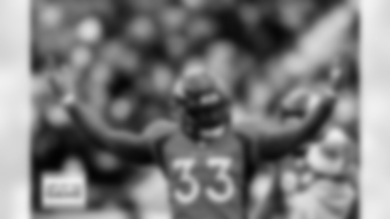 Denver Broncos running back Javonte Williams (33) pumps up the crowd during the Broncos' Week 8 game against the Kansas City Chiefs at Empower Field at Mile High in Denver, Colorado on October 29, 2023. Photo by Ben Swanson / Denver Broncos