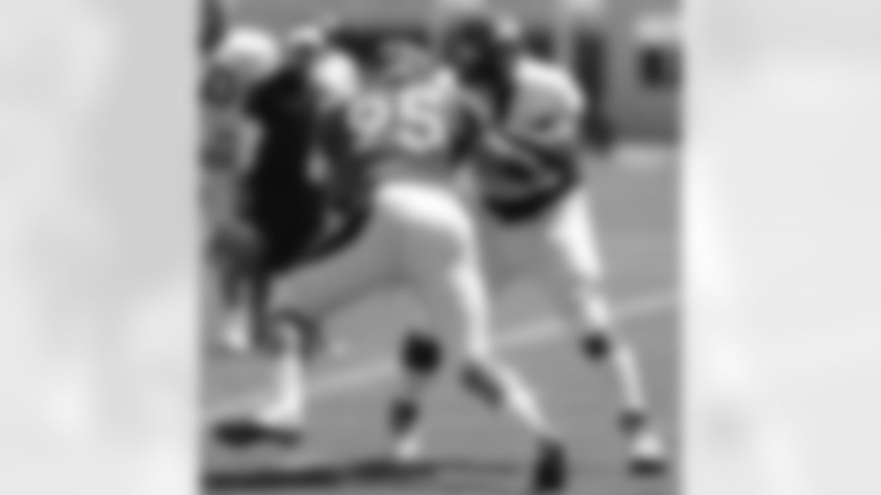 DL Derek Wolfe rushes the passer.