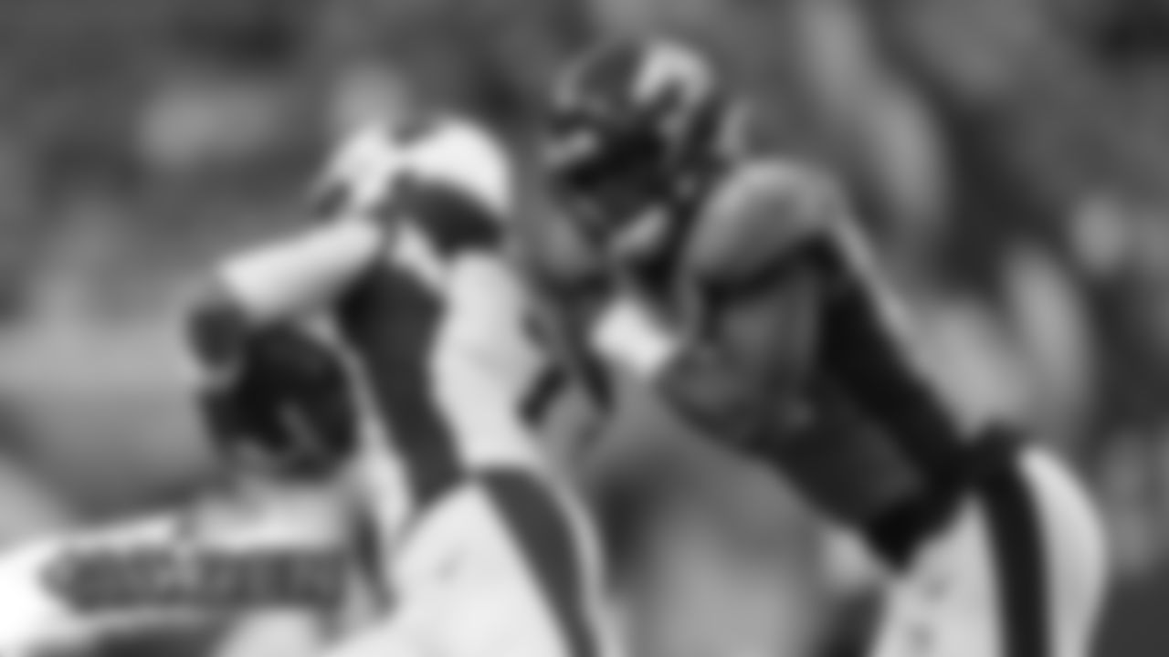 Justin Hollins takes down Arizona Cardinals quarterback Brett Hundley (7) during the Broncos' preseason game against the Arizona Cardinals on August 29, 2019 at Broncos Stadium at Mile High. (Photo by Gabriel Christus)