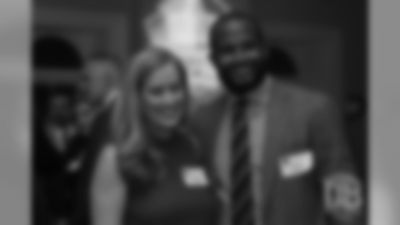 Brittany Bowlen greets Champ Bailey at the Pro Football Hall of Fame's Celebration of Excellence Reception in Atlanta on January 31, 2019.
