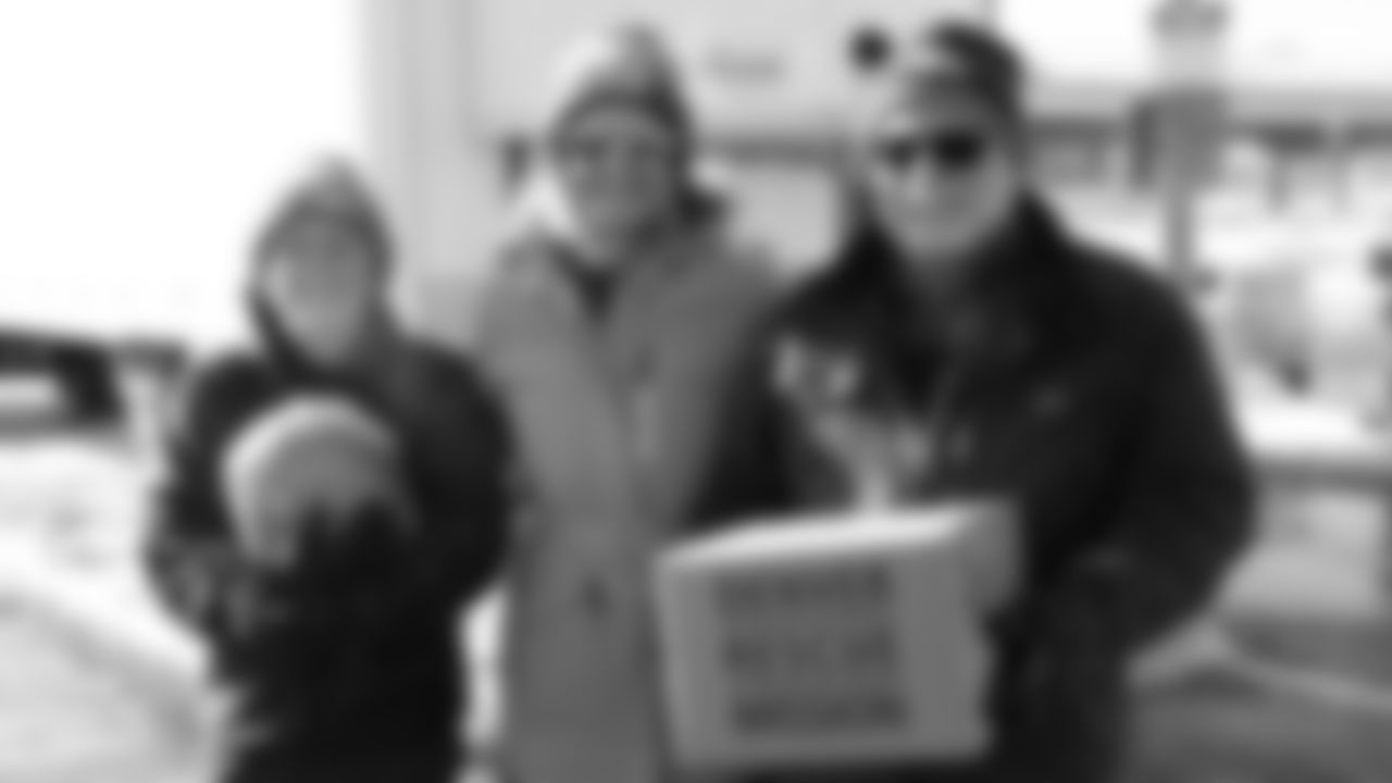 Volunteers from the Broncos WomenÕs Organization and the Denver Rescue Mission at Thanksgiving ÔBanquet in a BoxÕ Turkey Distribution outside Empower Field at Mile High on November 27, 2019 (Photo by Emily Simanskis)