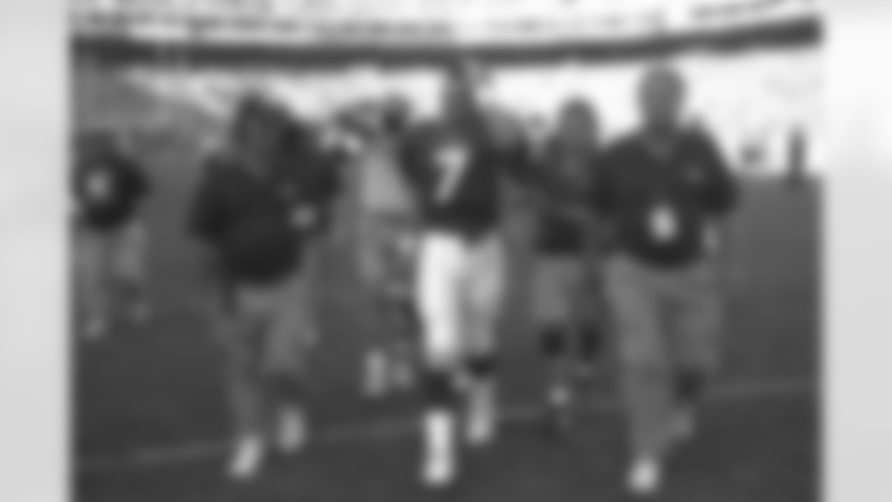 Denver: John Elway tips his hat to the crowd after a victory against the Rams against the St. Louis Rams at Mile High Stadium in Denver, CO on September 14, 1997.