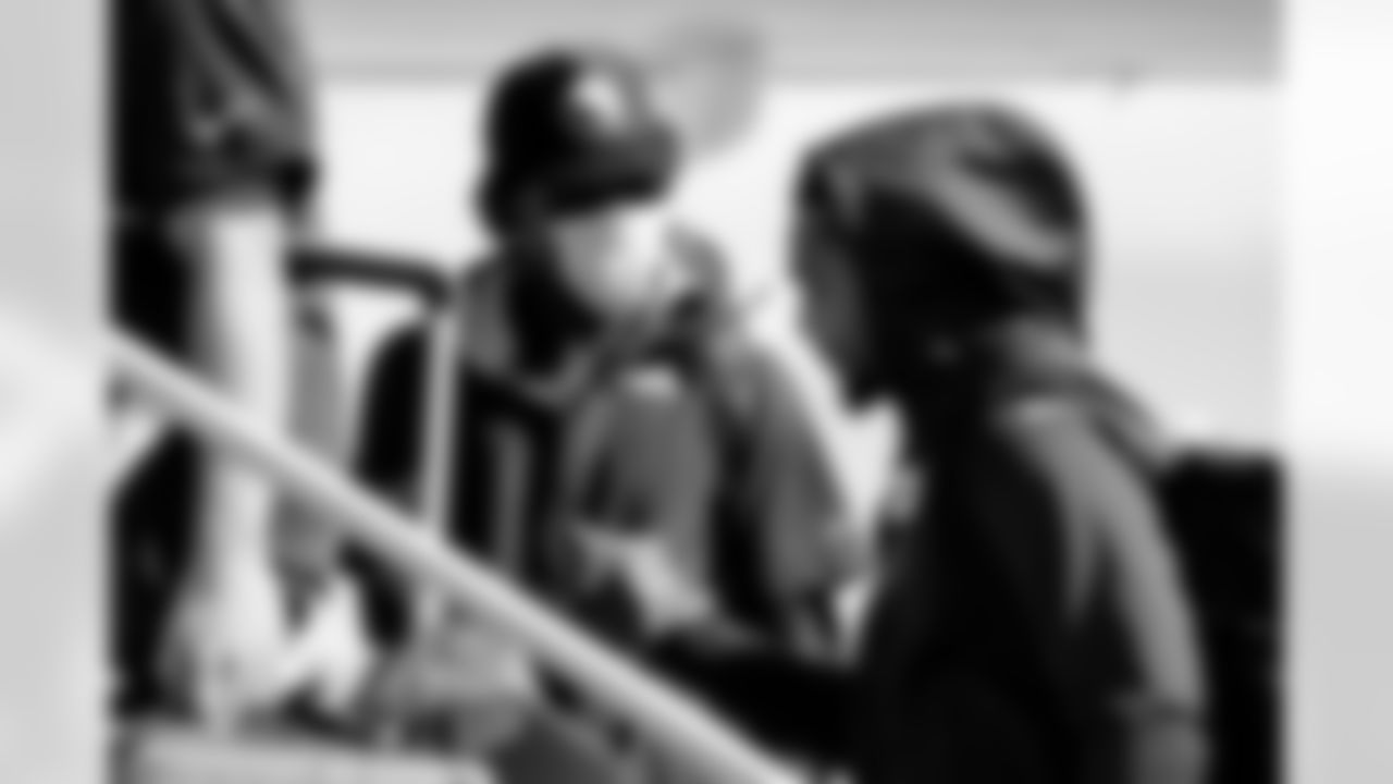 Teddy Bridgewater and Tyrie Cleveland on the tarmac at Denver International Airport on October 9, 2021 during the team's travel to Pittsburgh for a Week 5 game against the Steelers. (Photo by Joe Abdellah)