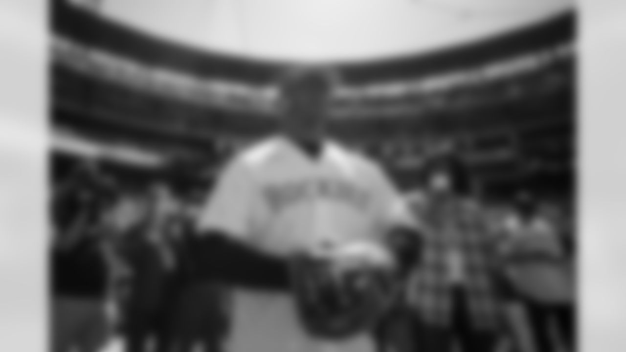 Russell Wilson prepares to throw the first pitch during his visit to the Colorado Rockies' Opening Day game at Coors Field in Denver, Colorado on April 8, 2022. (Photo by Ben Swanson)