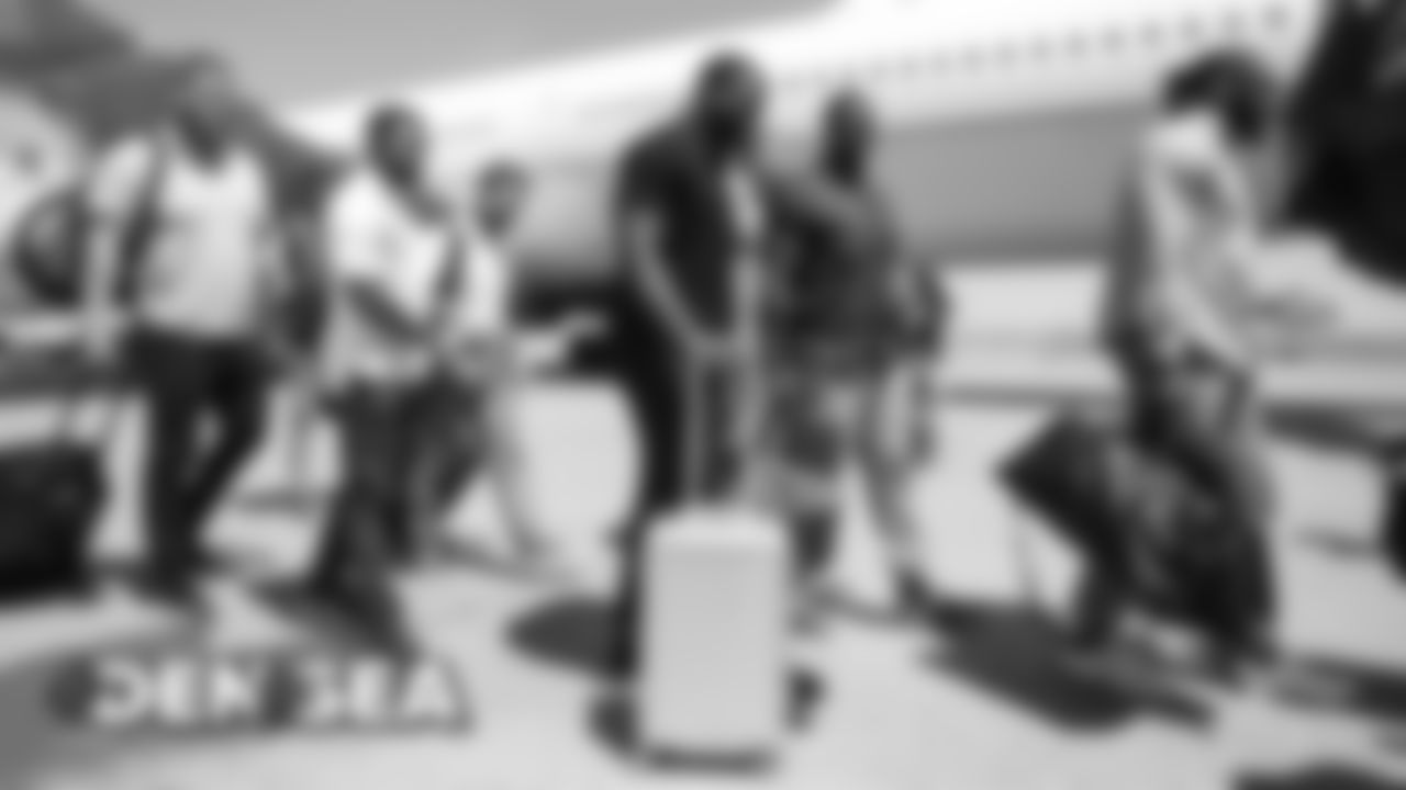 Royce Freeman on the tarmac for the Broncos' flight to Seattle on August 7, 2019 ahead of their game against the Seahawks.