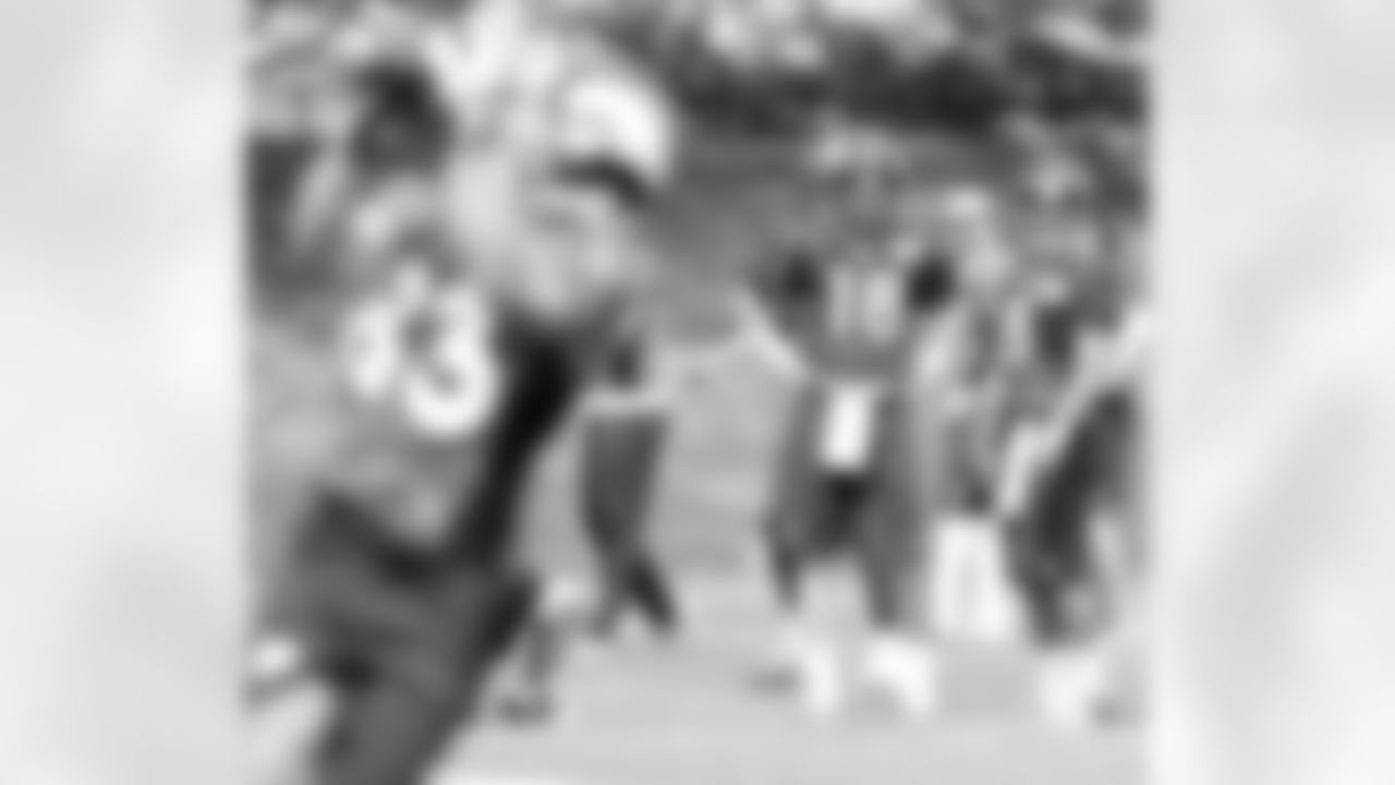 Peyton Manning and Ryan Katz watch Wes Welker