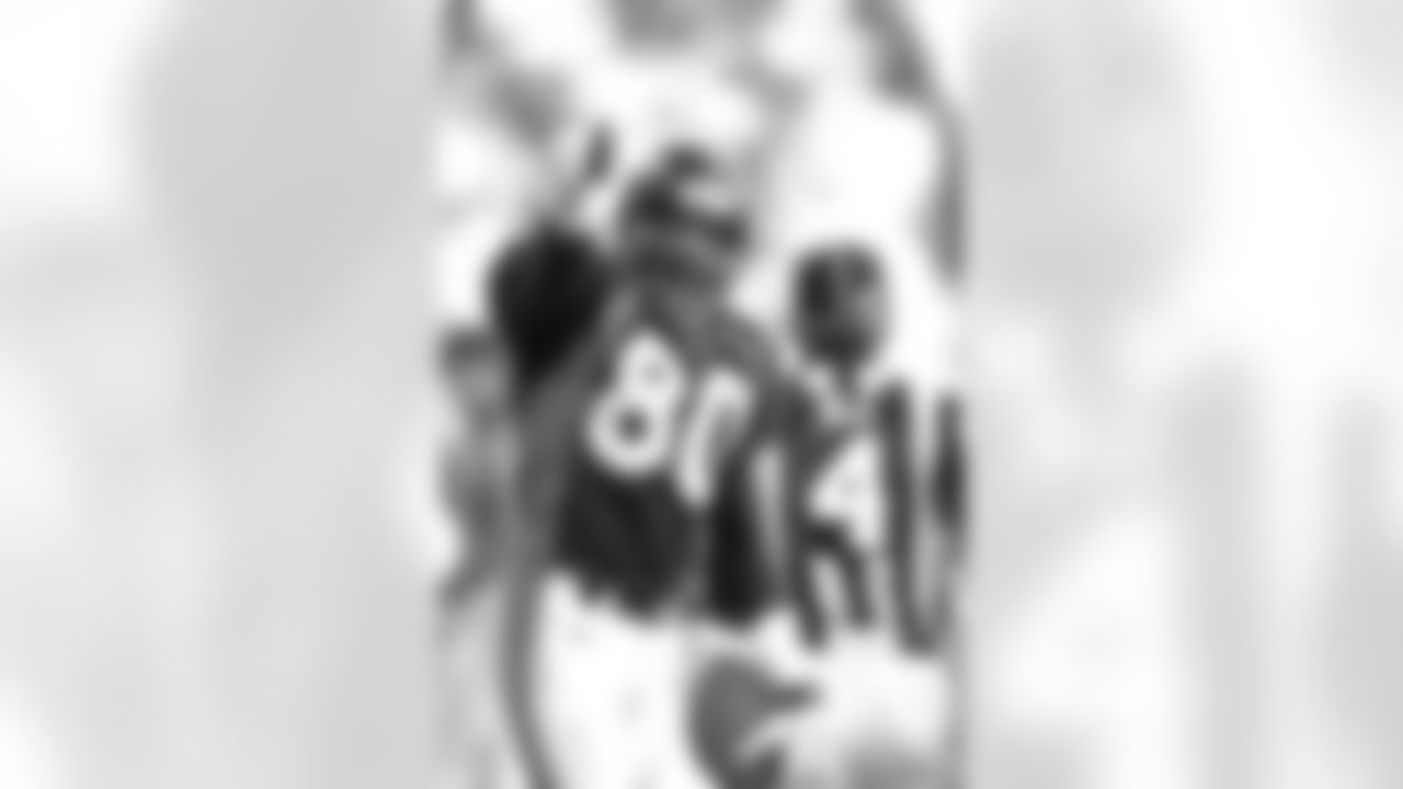 Rod Smith points to the crowd after a play against the Jacksonville Jaguars at Mile High Stadium in Denver, CO on December 27, 1997.