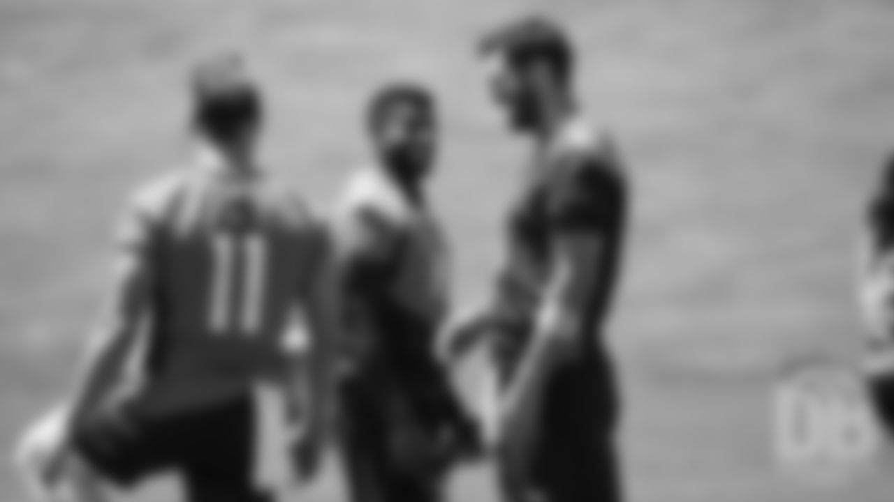 Emmanuel Sanders and Joe Flacco share a laugh before the Broncos' second mandatory minicamp practice on June 5, 2019.