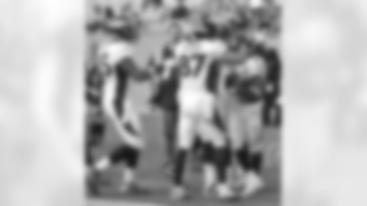 Hillman's teammates congratulate him on his touchdown.
