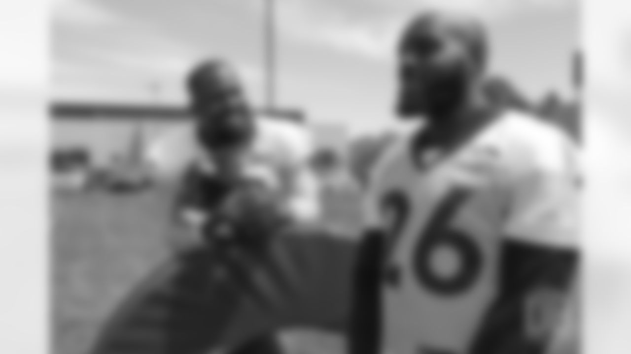 outside linebacker Von Miller (58) talks with safety Darian Stewart (26) on the sideline during the 10th and final day of OTAs on June 7, 2018 at UCHealth Training Center.
