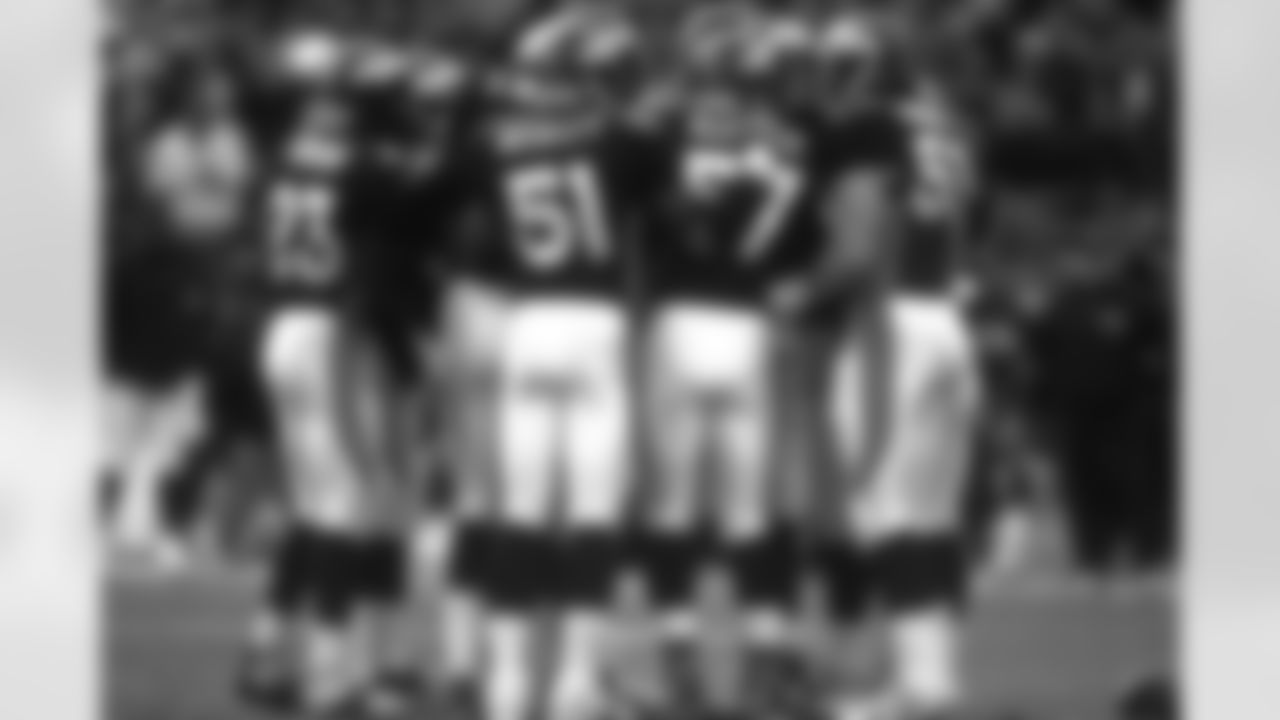 Denver: John Mobley and the Broncos defense gather before a snap against the Jaguars against the Jacksonville Jaguars at Mile High Stadium in Denver, CO on December 27, 1997.