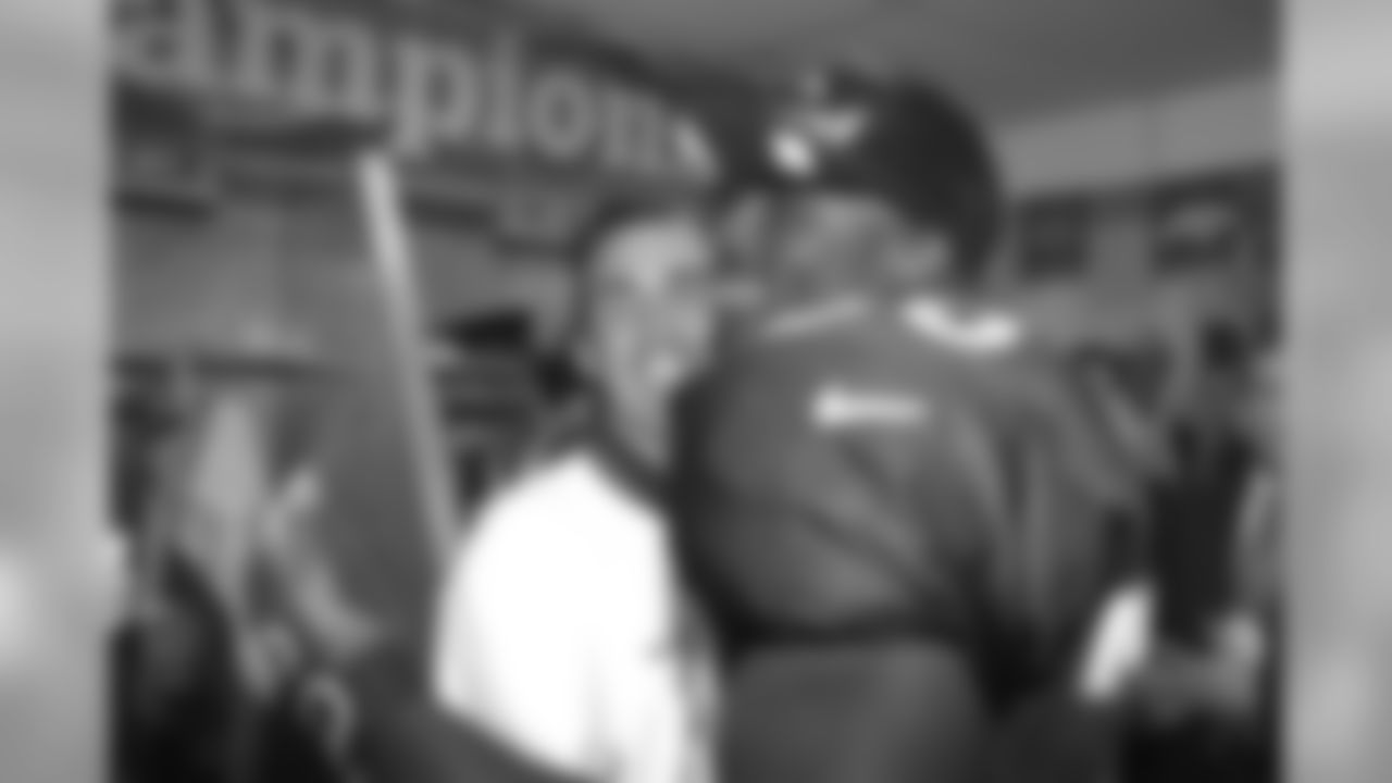 Super Bowl XXXII MVP Terrell Davis hugs Head Coach Mike Shanahan as he enters the locker room, continuing the post-game celebration against the Green Bay Packers at Qualcomm Stadium in San Diego, CA on January 25, 1998.