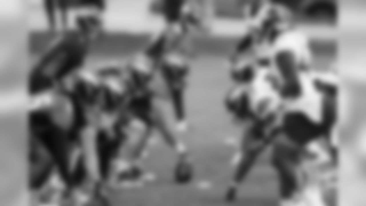 Players line up at the line of scrimmage during the first day of voluntary veteran minicamp on April 16, 2019.