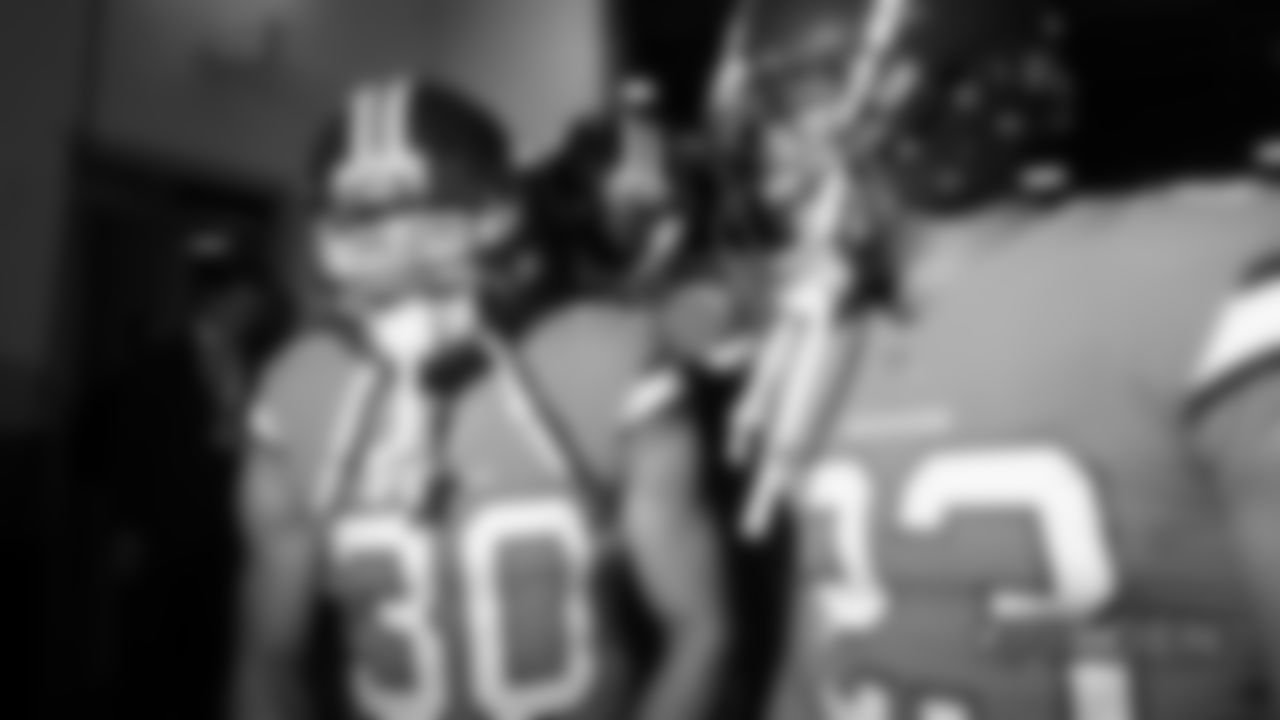 Phillip Lindsay and Devontae Booker in the tunnel during player introductions before the Broncos' Week 12 game against the Pittsburgh Steelers at Broncos Stadium at Mile High on November 25, 2018.