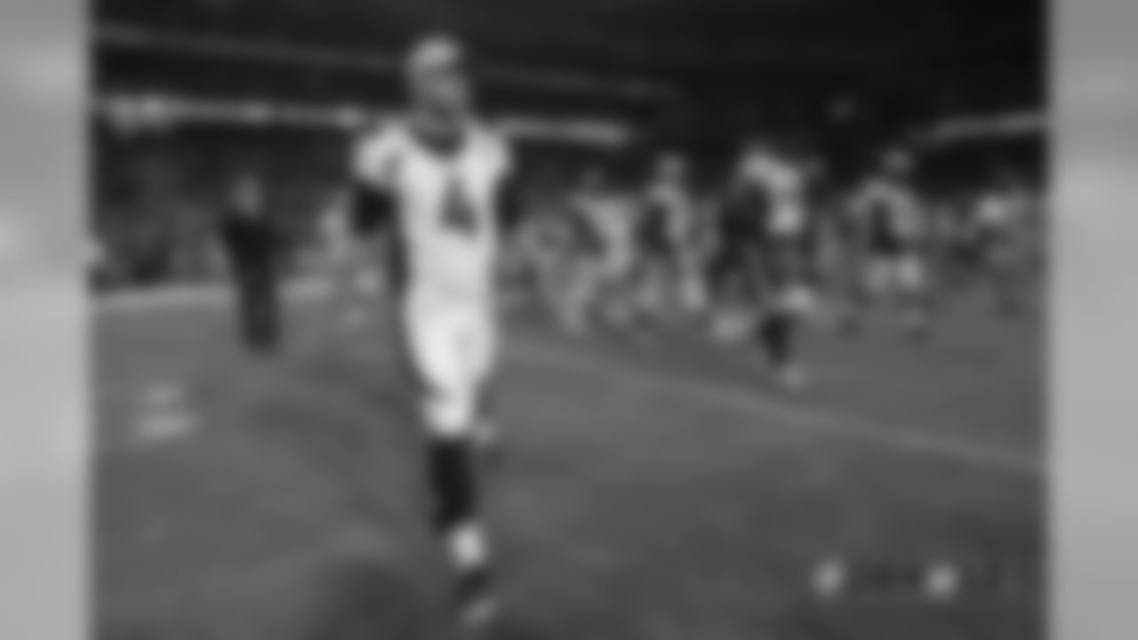 Case Keenum walks across the field to greet Cardinals players after the Broncos' preseason game against the Arizona Cardinals on August 30, 2018.