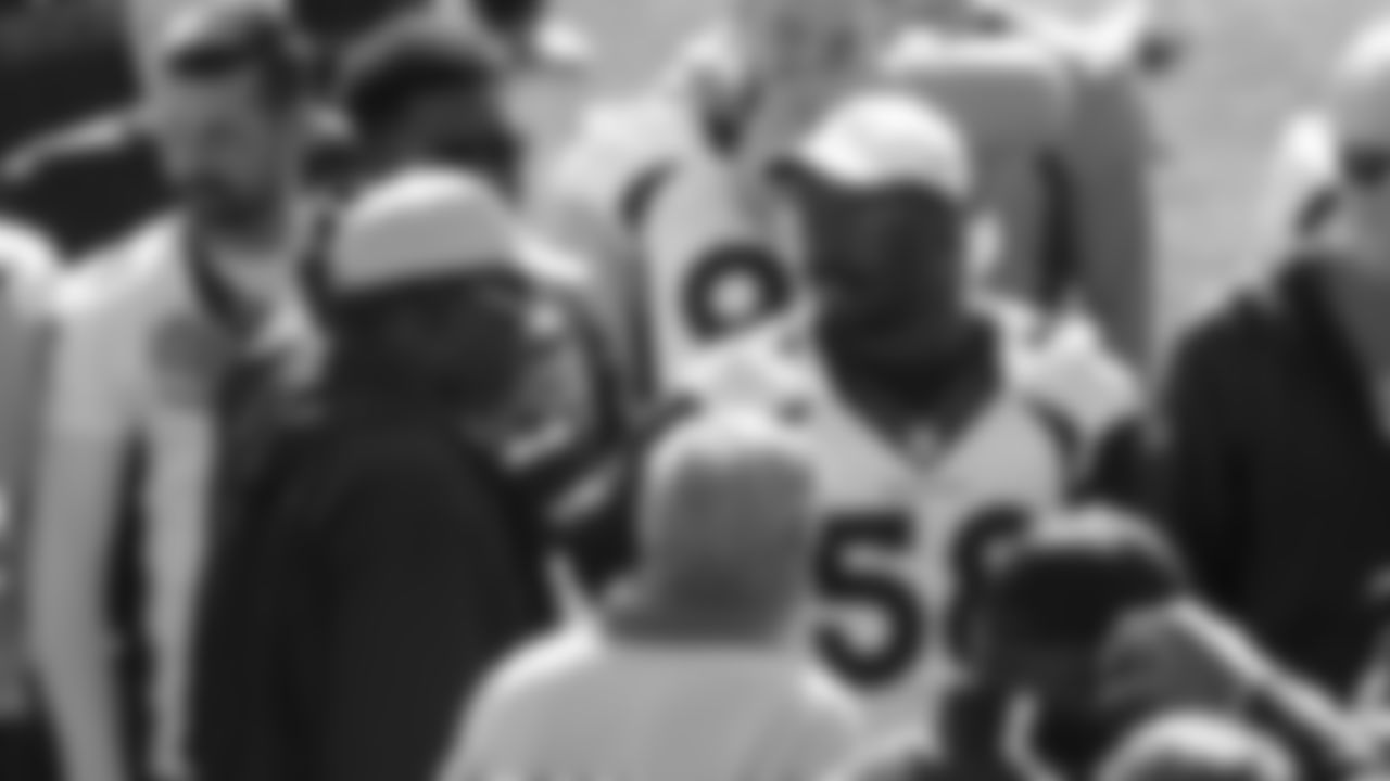 Von Miller talks with Simon Fletcher as Broncos alumni watch the team's walkthrough and meet with current players and coaches afterward on October 12, 2019. (Photo by Ben Swanson)
