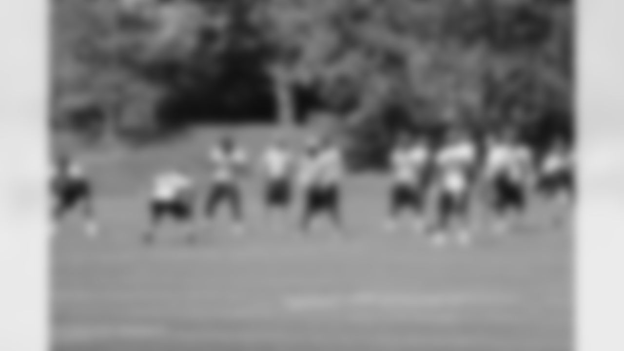 Broncos linebackers go through a drill.