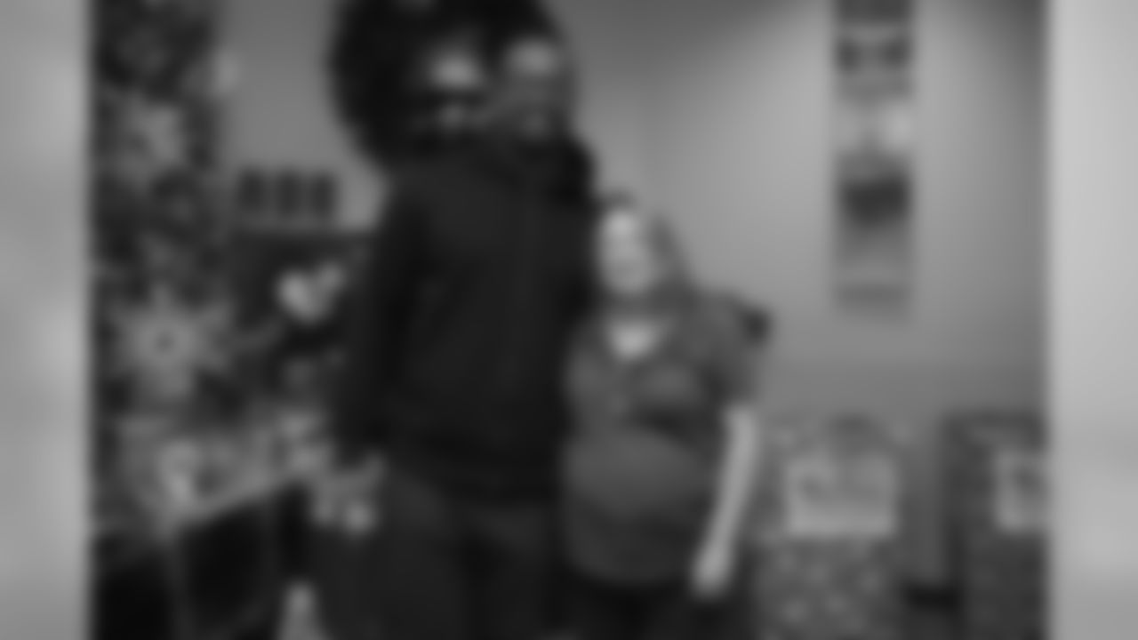 Von Miller takes photos with fans to help encourage donations at a toy drive for Boys & Girls Clubs of Metro Denver for the holidays on December 23, 2019. (Photo by Ben Swanson)