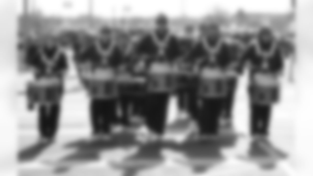 A Drumline Marches Outside Stadium
