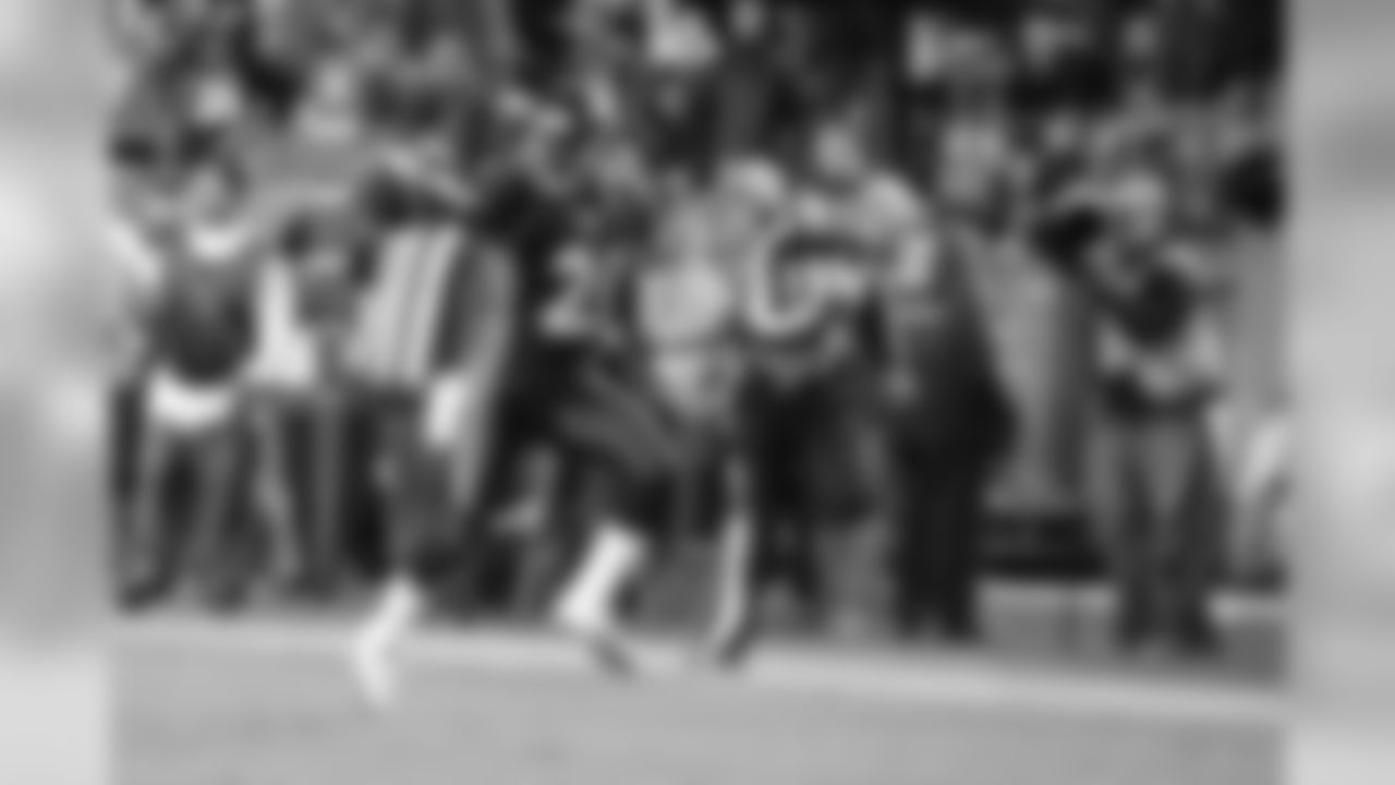 Andre Goodman returns an interception 26 yards for a touchdown in the third quarter of the Broncos' 17-13 win on Nov. 17, 2011.