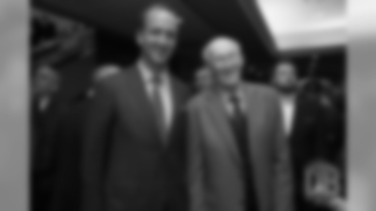 pictured: Manning and Joe Collier, the former Broncos defensive coordinator who led the franchise's famous "Orange Crush" defense