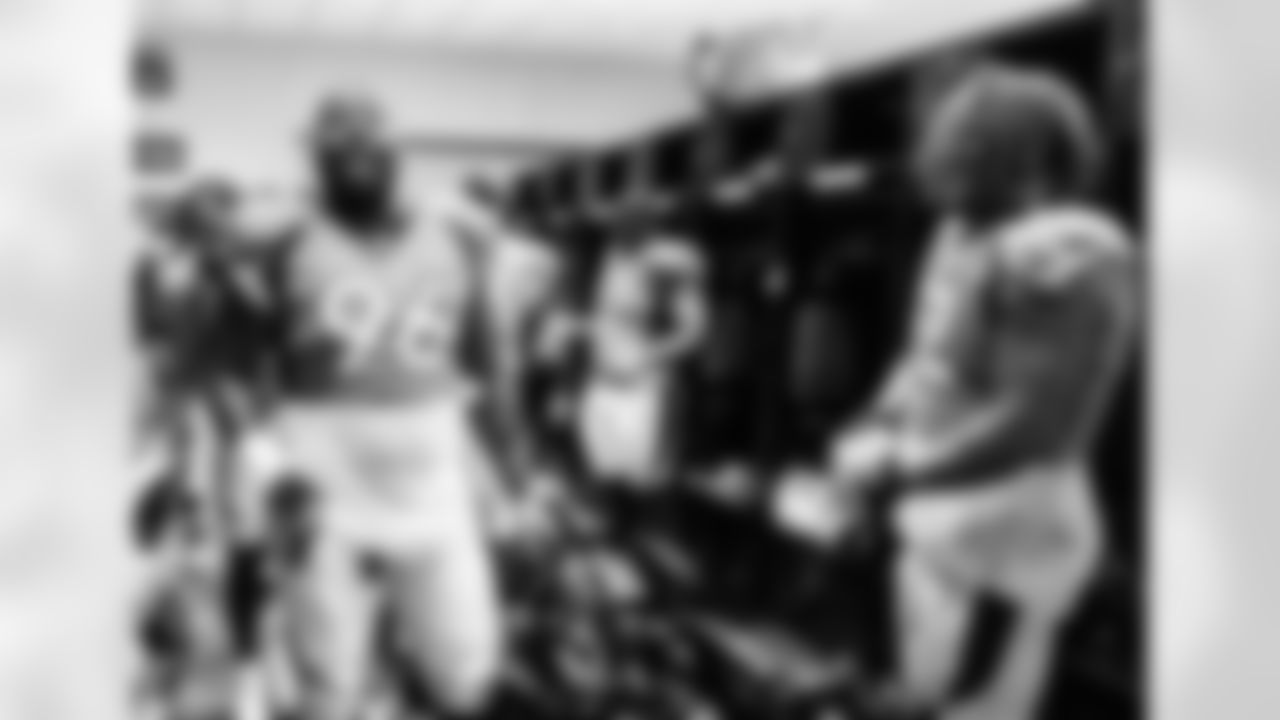 Shelby Harris and Netane Muti during the postgame celebration inside the Broncos' locker room after Week 2 win over the Jacksonville Jaguars at TIAA Bank Field in Jacksonville, Florida on September 19, 2021. (Photo by Austin Brink)