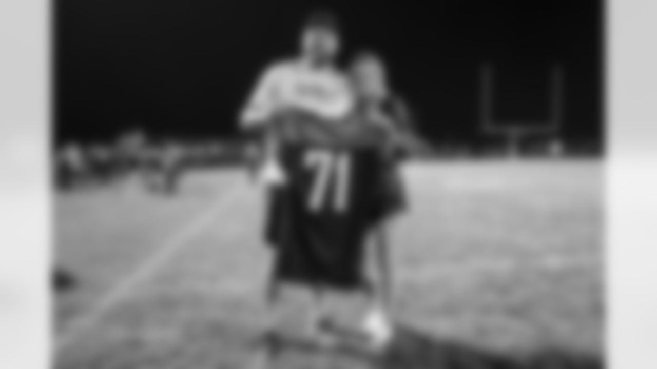 Dalton Risner and his fiancé at Dalton Risner's jersey retirement ceremony at Wiggins High School in Wiggins, CO on September 2, 2021.