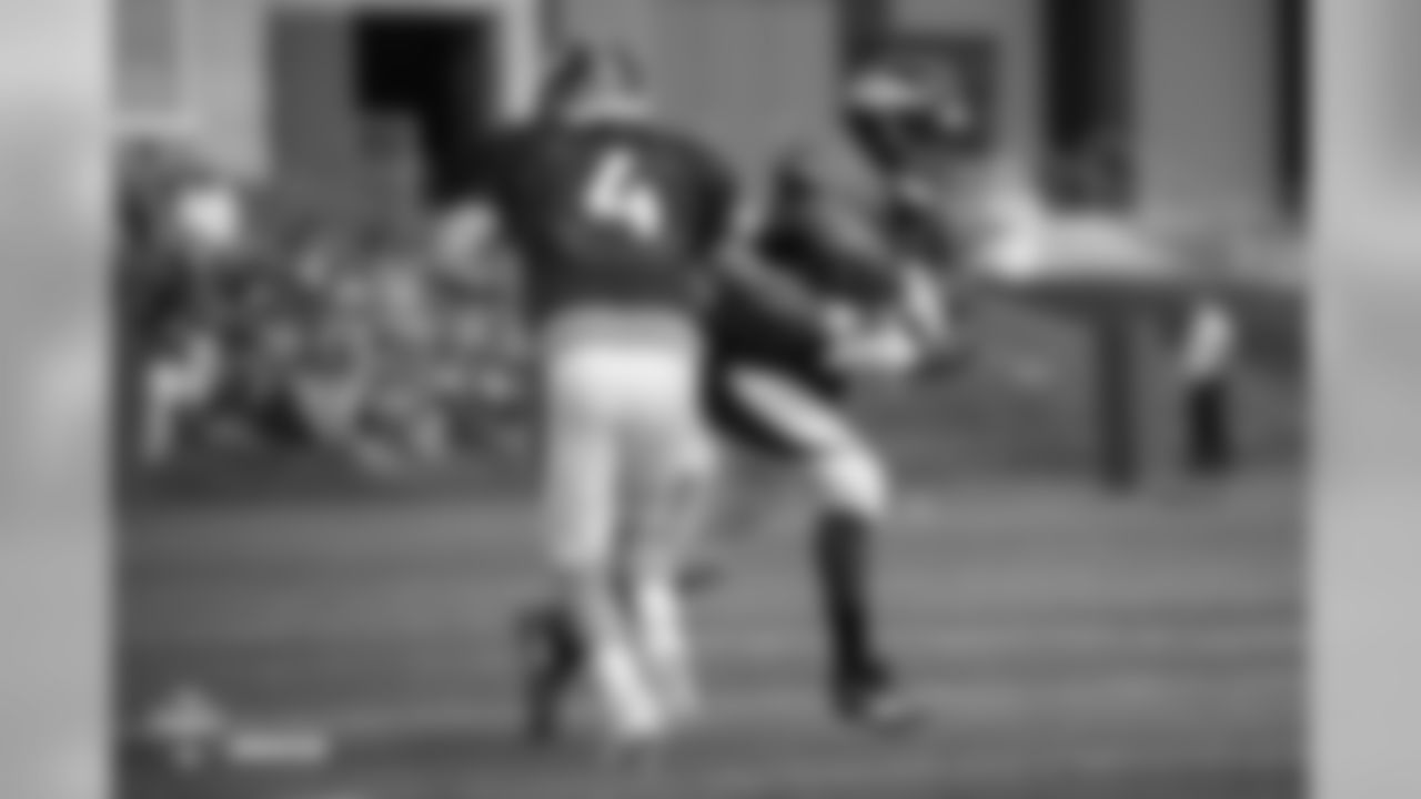 Running back Devontae Booker (23) takes a handoff from quarterback Case Keenum (4) at the fifth day of training camp on August 1, 2018, at UCHealth Training Center.
